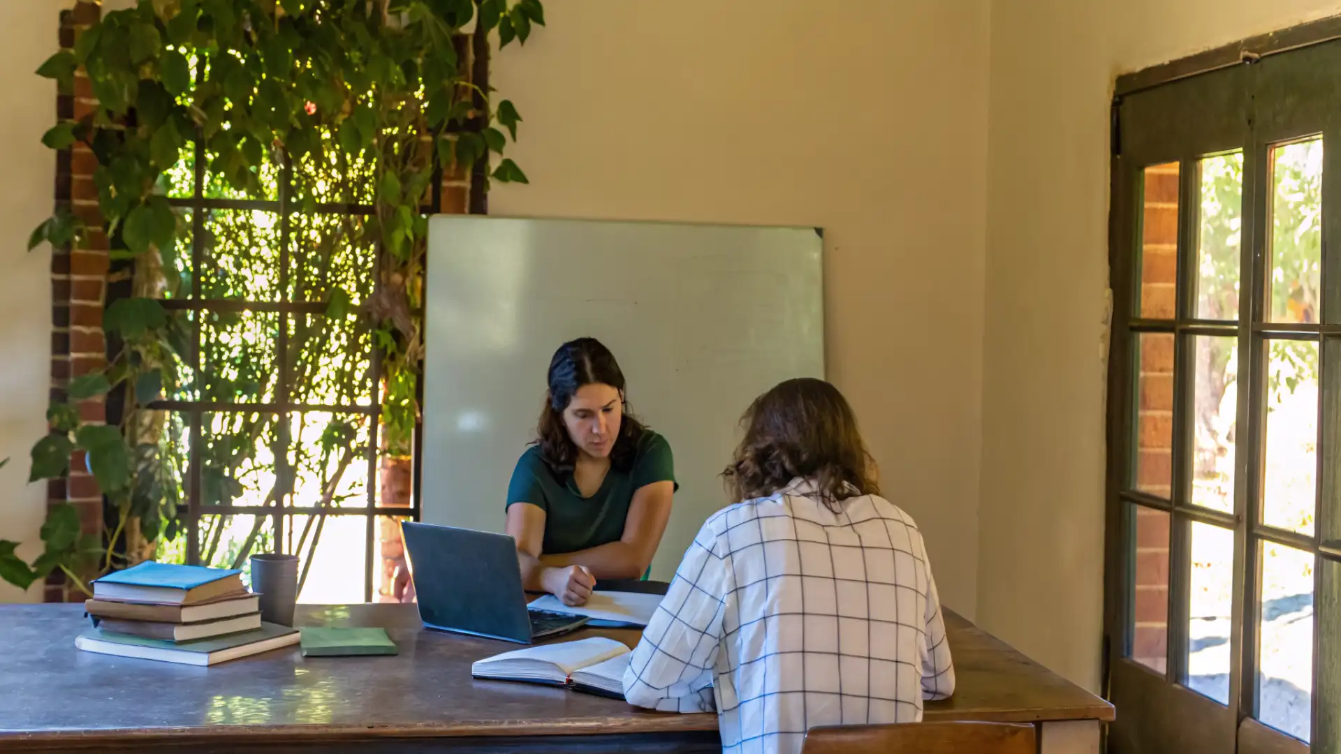 Tutor working one-on-one with a student during summer tutoring session